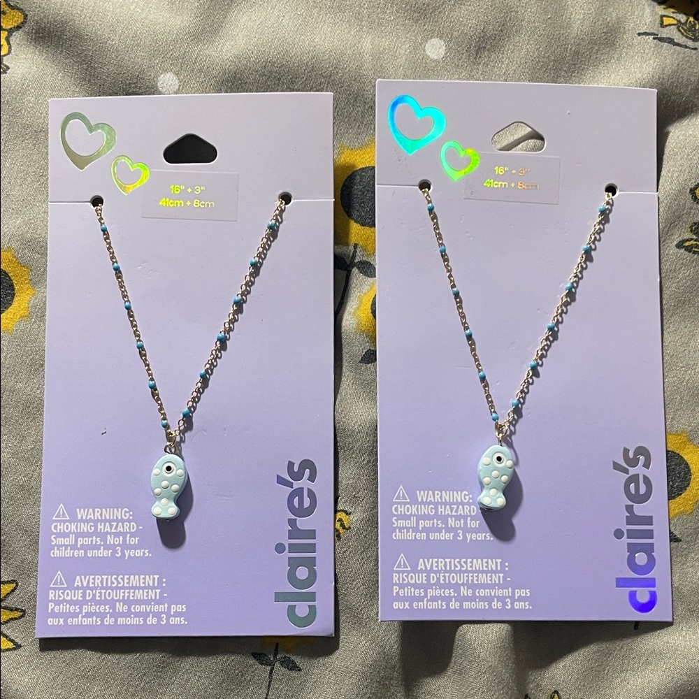 Claire's necklace with a light blue fish pendant necklace